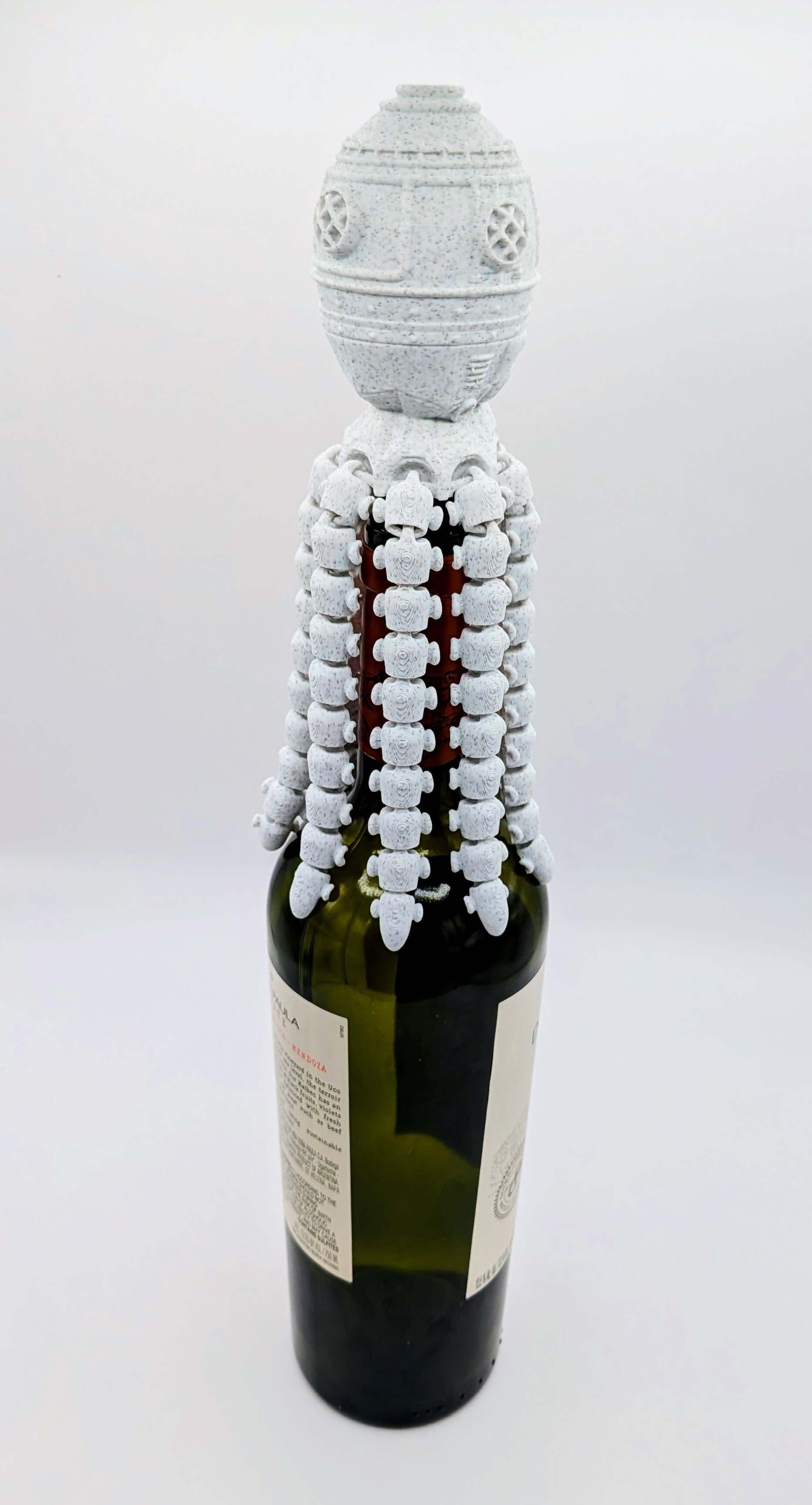 OctoGauge Wine Stopper designed like an octopus, elegantly securing a wine bottle with a unique tentacle design.